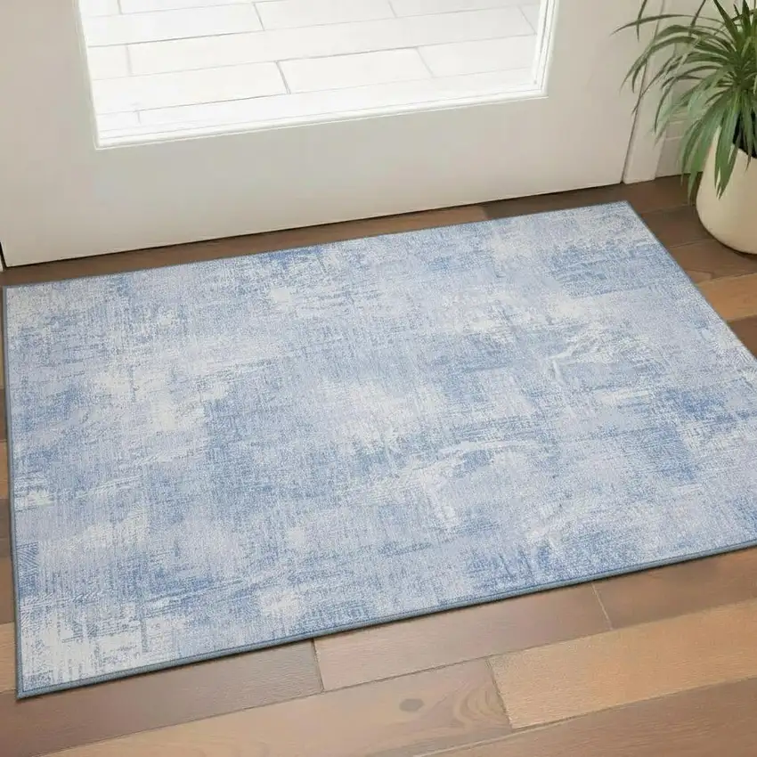 Sky Blue And Ivory Abstract Washable Area Rug With UV Protection Photo 1