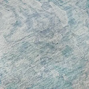 Photo of Sky Blue And Ivory Abstract Washable Area Rug With UV Protection