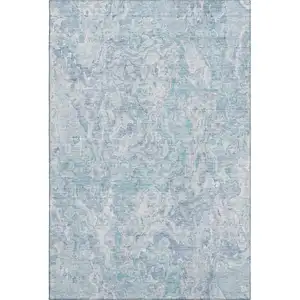 Photo of Sky Blue And Ivory Abstract Washable Area Rug With UV Protection