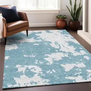 Photo of Sky Blue And Ivory Abstract Washable Area Rug With UV Protection