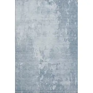 Photo of Sky Blue And Ivory Abstract Washable Area Rug With UV Protection