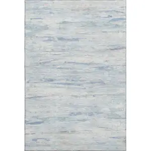 Photo of Sky Blue And Ivory Abstract Washable Area Rug With UV Protection