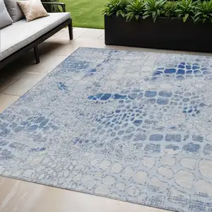 Photo of Sky Blue And Ivory Abstract Washable Indoor Outdoor Area Rug
