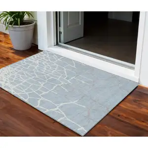 Photo of Sky Blue And Ivory Abstract Washable Indoor Outdoor Area Rug
