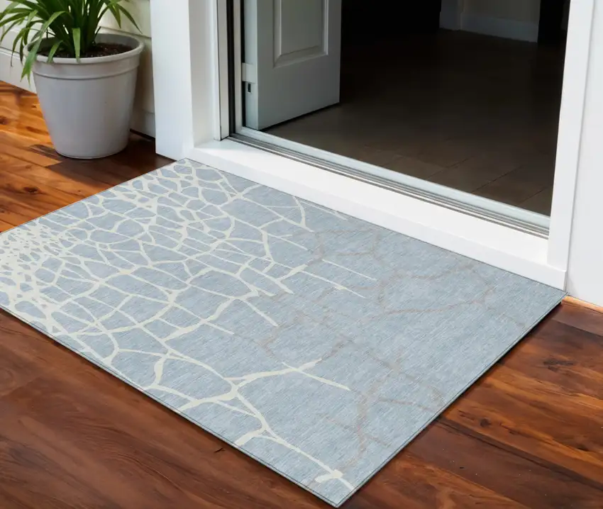 Sky Blue And Ivory Abstract Washable Indoor Outdoor Area Rug Photo 1