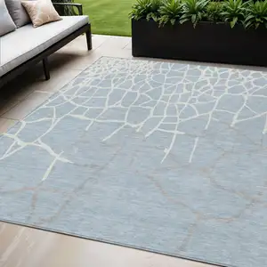 Photo of Sky Blue And Ivory Abstract Washable Indoor Outdoor Area Rug