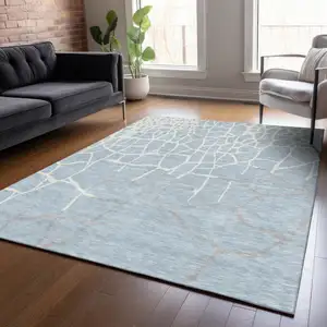 Photo of Sky Blue And Ivory Abstract Washable Indoor Outdoor Area Rug