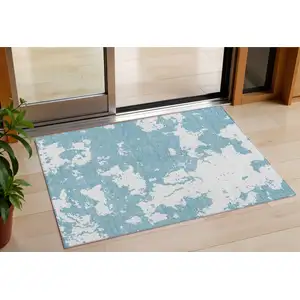 Photo of Sky Blue And Ivory Abstract Washable Indoor Outdoor Area Rug