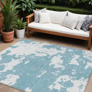 Photo of Sky Blue And Ivory Abstract Washable Indoor Outdoor Area Rug