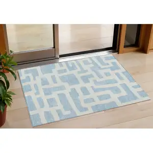Photo of Sky Blue And Ivory Abstract Washable Indoor Outdoor Area Rug