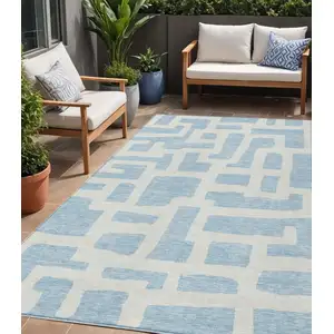 Photo of Sky Blue And Ivory Abstract Washable Indoor Outdoor Area Rug