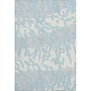 Photo of Sky Blue And Ivory Animal Print Washable Area Rug With UV Protection