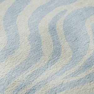 Photo of Sky Blue And Ivory Animal Print Washable Area Rug With UV Protection