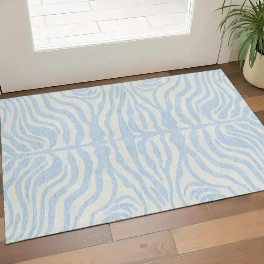 Sky Blue And Ivory Animal Print Washable Area Rug With UV Protection Photo 1