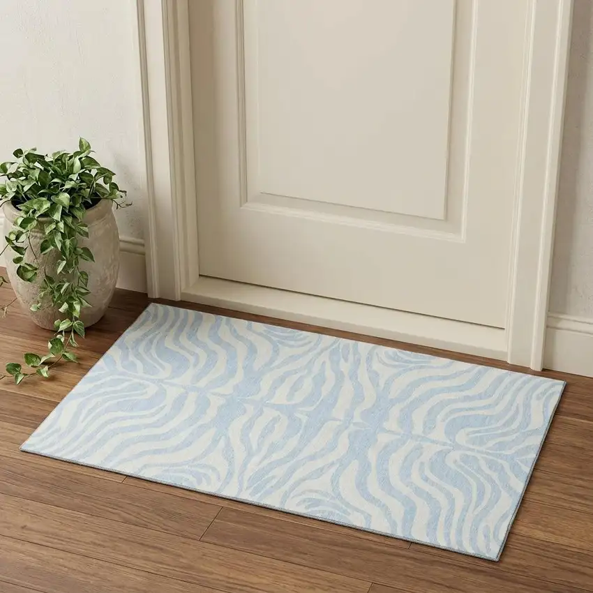 Sky Blue And Ivory Animal Print Washable Area Rug With UV Protection Photo 1