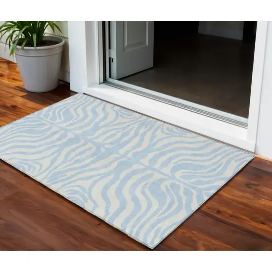 Sky Blue And Ivory Animal Print Washable Indoor Outdoor Area Rug Photo 1