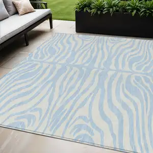 Photo of Sky Blue And Ivory Animal Print Washable Indoor Outdoor Area Rug