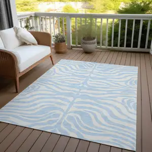 Photo of Sky Blue And Ivory Animal Print Washable Indoor Outdoor Area Rug