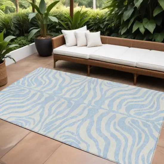 Sky Blue And Ivory Animal Print Washable Indoor Outdoor Area Rug Photo 1