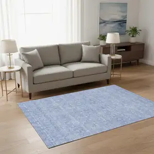 Photo of Sky Blue And Ivory Floral Washable Area Rug With UV Protection