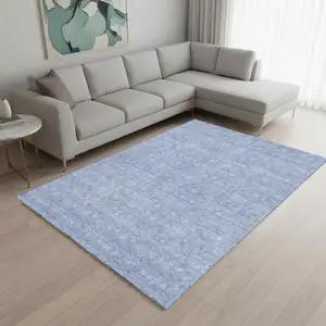 Photo of Sky Blue And Ivory Floral Washable Area Rug With UV Protection
