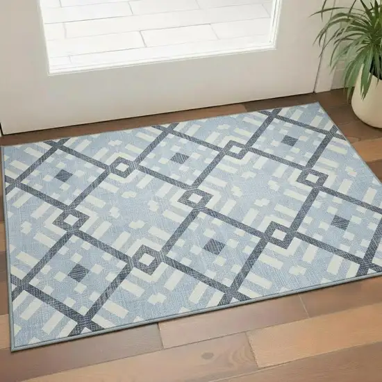 Sky Blue And Ivory Geometric Washable Area Rug With UV Protection Photo 1