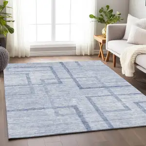 Photo of Sky Blue And Ivory Geometric Washable Area Rug With UV Protection