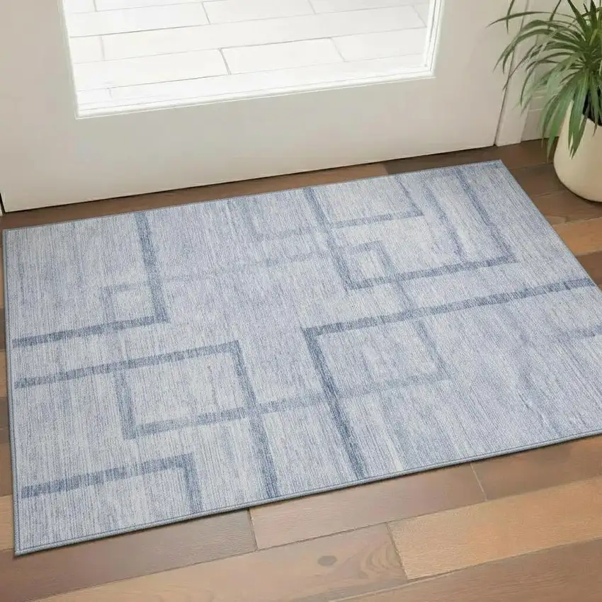 Sky Blue And Ivory Geometric Washable Area Rug With UV Protection Photo 1
