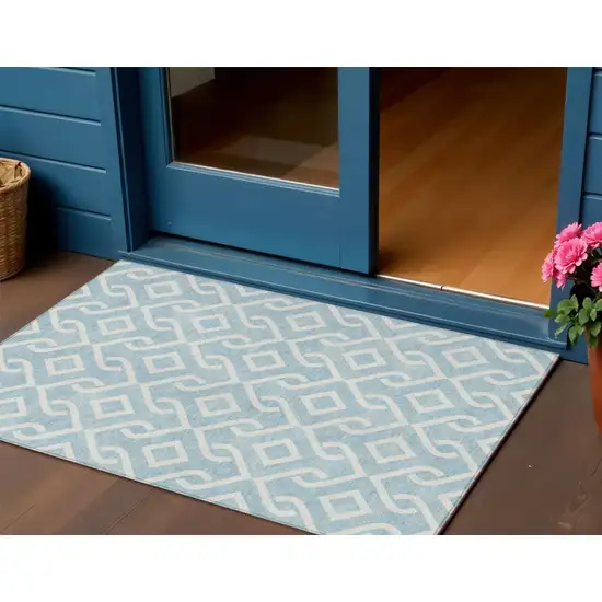 Sky Blue And Ivory Geometric Washable Indoor Outdoor Area Rug Photo 1