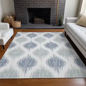 Photo of Sky Blue And Ivory Ikat Washable Area Rug With UV Protection