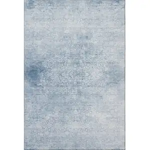 Photo of Sky Blue And Ivory Oriental Washable Area Rug With UV Protection