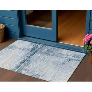 Photo of Sky Blue And Ivory Striped Washable Indoor Outdoor Area Rug