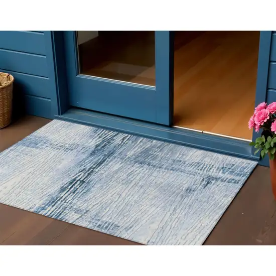 Sky Blue And Ivory Striped Washable Indoor Outdoor Area Rug Photo 1