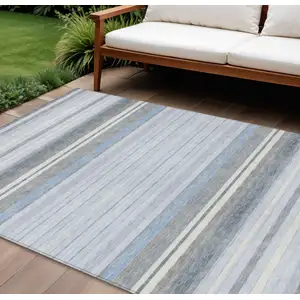 Photo of Sky Blue And Ivory Striped Washable Indoor Outdoor Area Rug