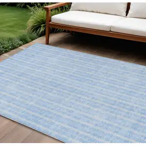Photo of Sky Blue And Ivory Striped Washable Indoor Outdoor Area Rug
