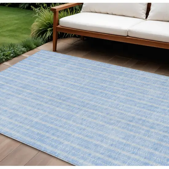 Sky Blue And Ivory Striped Washable Indoor Outdoor Area Rug Photo 1