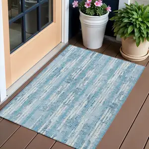 Photo of Sky Blue And Ivory Striped Washable Indoor Outdoor Area Rug