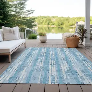 Photo of Sky Blue And Ivory Striped Washable Indoor Outdoor Area Rug