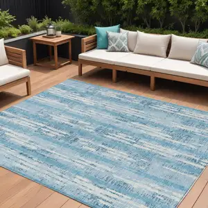 Photo of Sky Blue And Ivory Striped Washable Indoor Outdoor Area Rug
