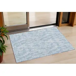 Photo of Sky Blue And Ivory Tribal Washable Indoor Outdoor Area Rug
