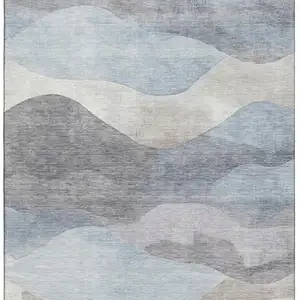 Photo of Sky Blue Beige And Ivory Abstract Washable Area Rug With UV Protection
