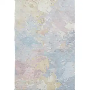 Photo of Sky Blue Beige And Mauve Abstract Washable Area Rug With UV Protection
