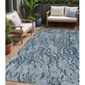 Photo of Sky Blue Black And Teal Blue Abstract Washable Indoor Outdoor Area Rug