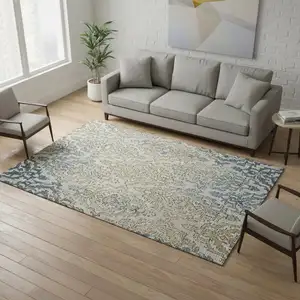 Photo of Sky Blue Gold And Ivory Medallion Washable Area Rug With UV Protection