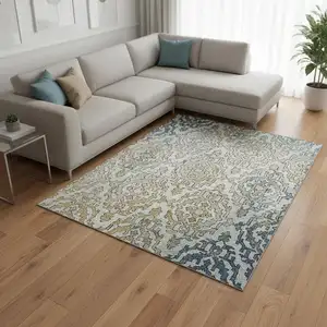 Photo of Sky Blue Gold And Ivory Medallion Washable Area Rug With UV Protection