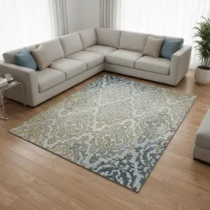Photo of Sky Blue Gold And Ivory Medallion Washable Area Rug With UV Protection