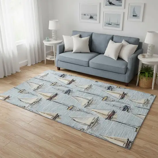 Sky Blue Gold And Ivory Nautical Washable Area Rug With UV Protection Photo 1