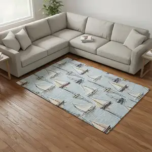 Photo of Sky Blue Gold And Ivory Nautical Washable Area Rug With UV Protection