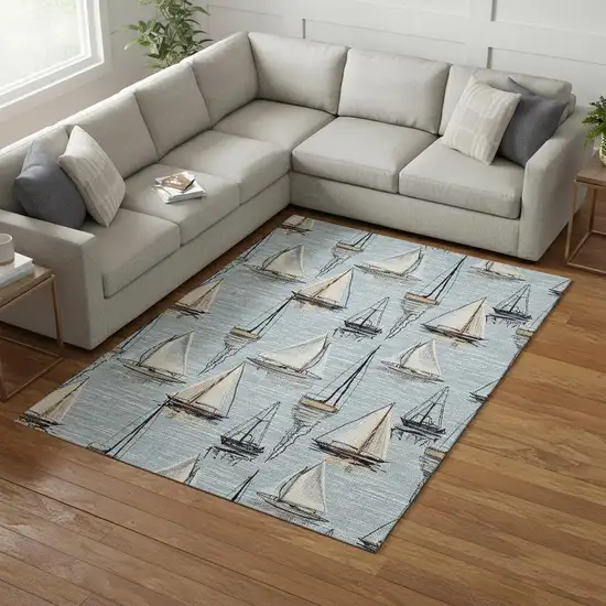 Sky Blue Gold And Ivory Nautical Washable Area Rug With UV Protection Photo 1