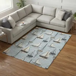Photo of Sky Blue Gold And Ivory Nautical Washable Area Rug With UV Protection